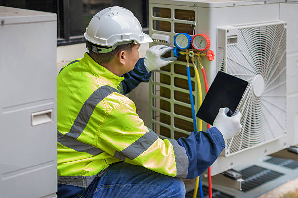 Professional Heat Pump Repair technician working in Comstock, NY